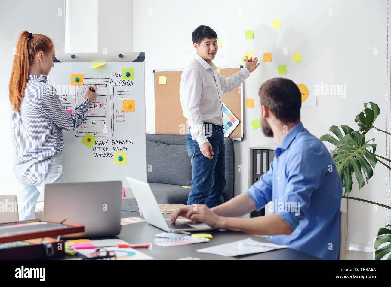 Young IT designers working in office Stock Photo
