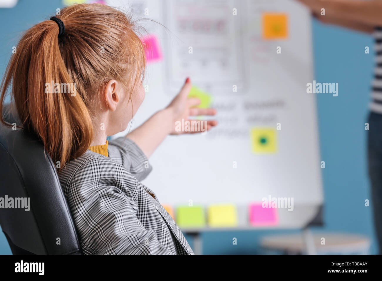 Female IT designer working in office Stock Photo