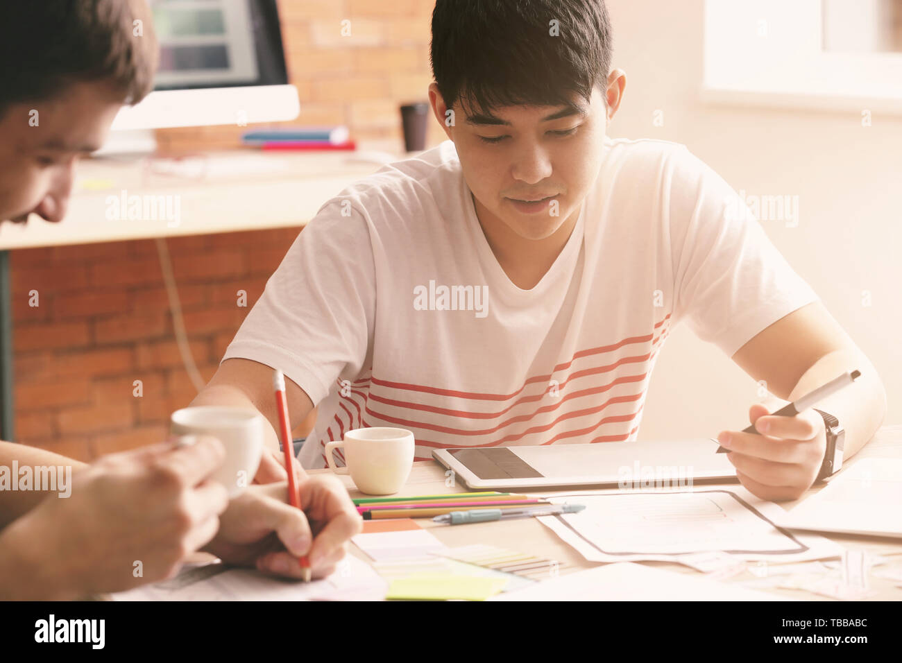 Young IT designers working in office Stock Photo
