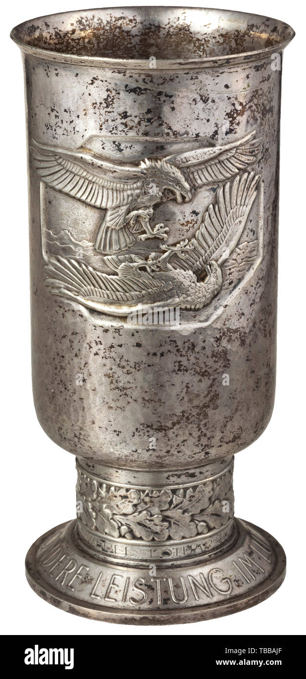 A Goblet of Honour for outstanding achievement in the air war - observer Lothar Kroczek, Goblet of the second type, produced in silver-plated alpacca with engraved name 'OBERFELDWEBEL LOTHAR KROCZEK AM 7.11.42'. The base with customary maker and material statement. A cleaned, rubbed goblet of an aerial observer. Height 20.7 cm. Weight 368 g. historic, historical 20th century, Editorial-Use-Only Stock Photo