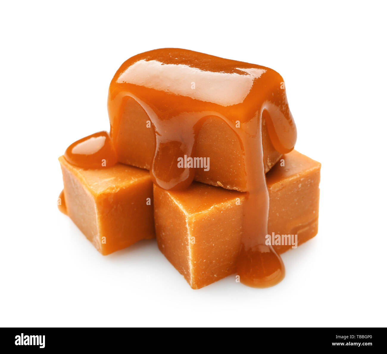 Tasty sweet caramel on white background Stock Photo - Alamy