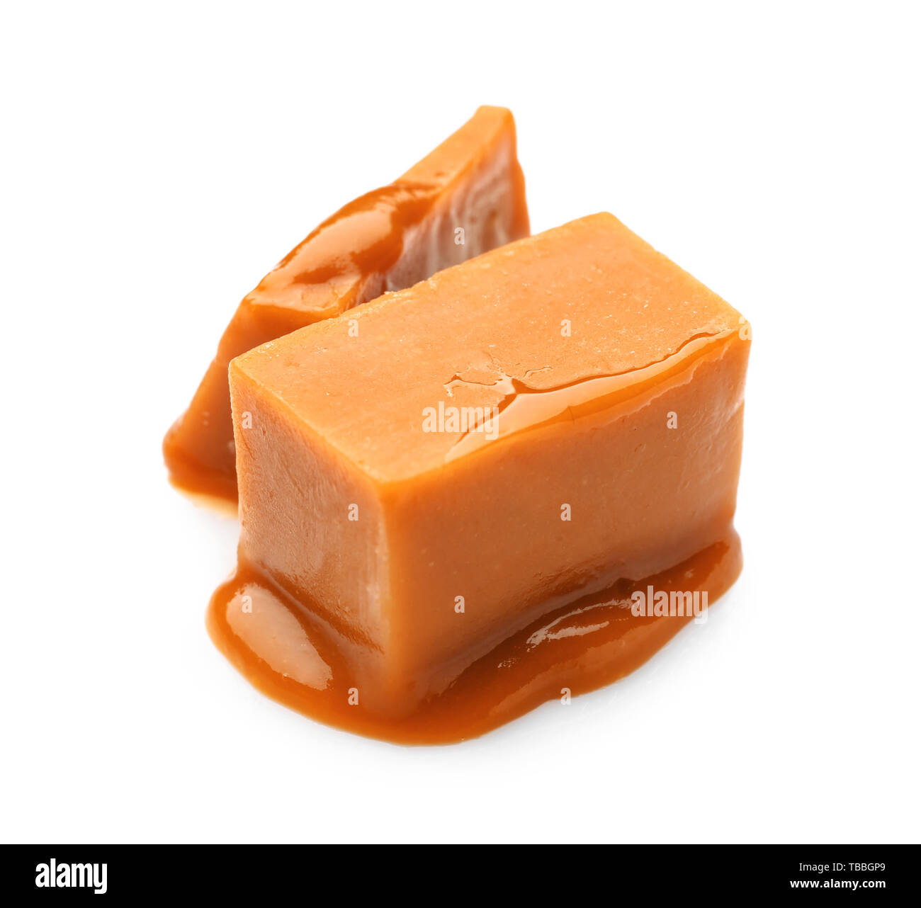Tasty sweet caramel on white background Stock Photo - Alamy