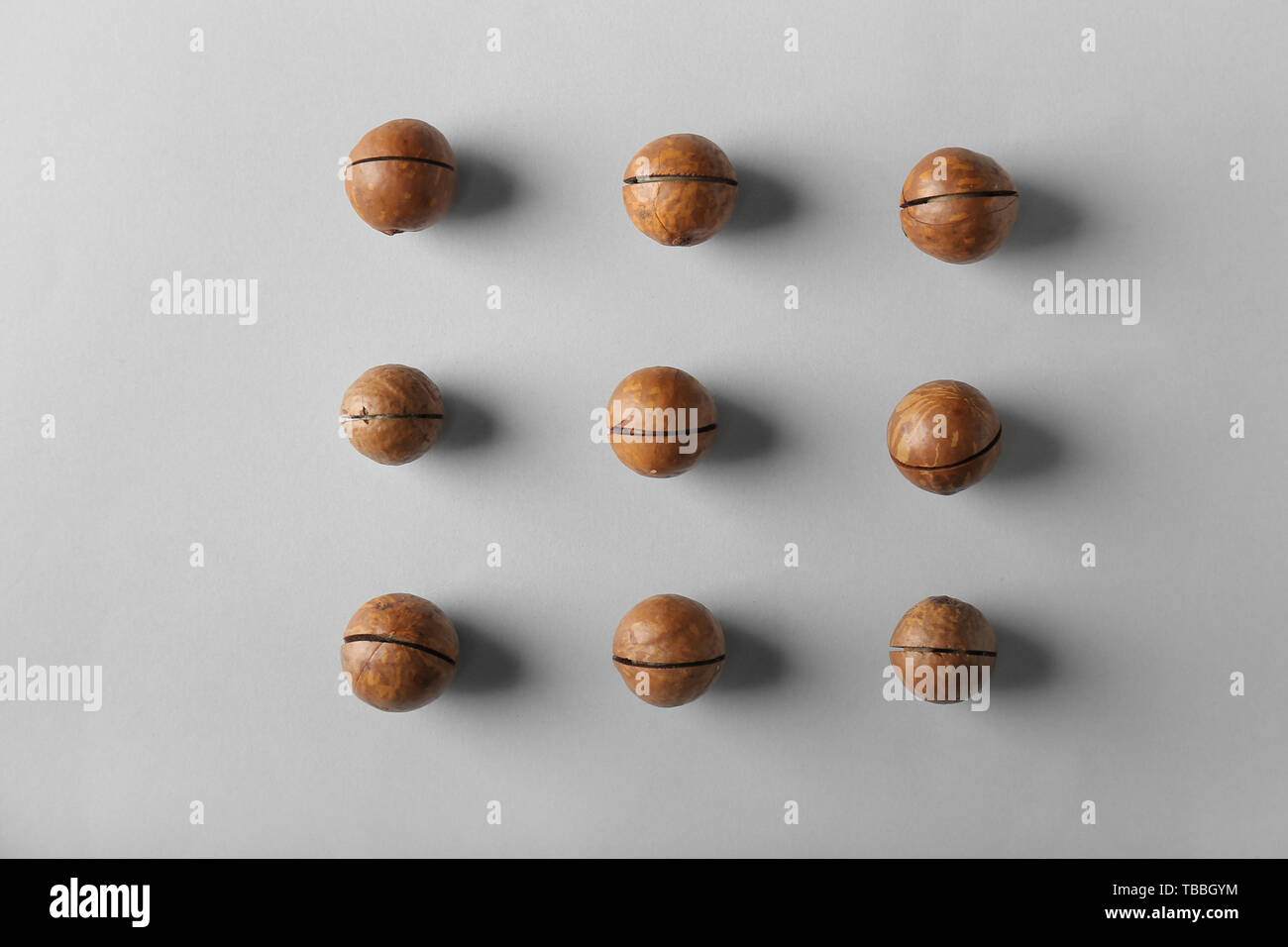 Tasty macadamia nuts on light background Stock Photo
