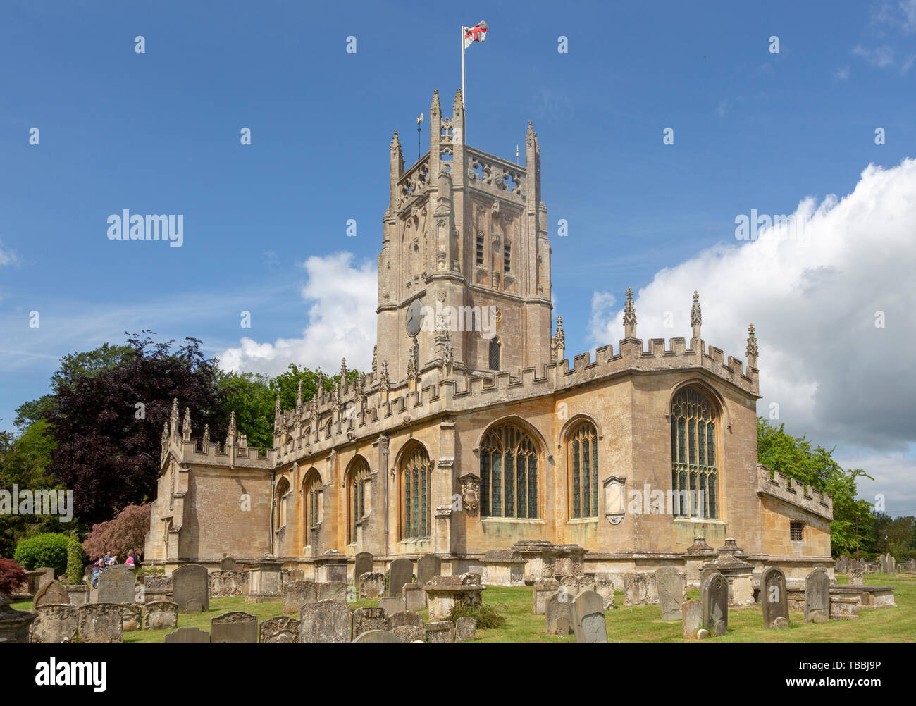 Cotswolds historic stone building churchyard of Church of Saint Mary, Fairford, Gloucestershire, England, UK Stock Photo