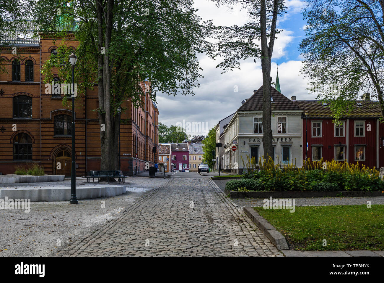 Traditional cobbled street in Trondheim city center near Var Frue Kirke, Norway Stock Photo