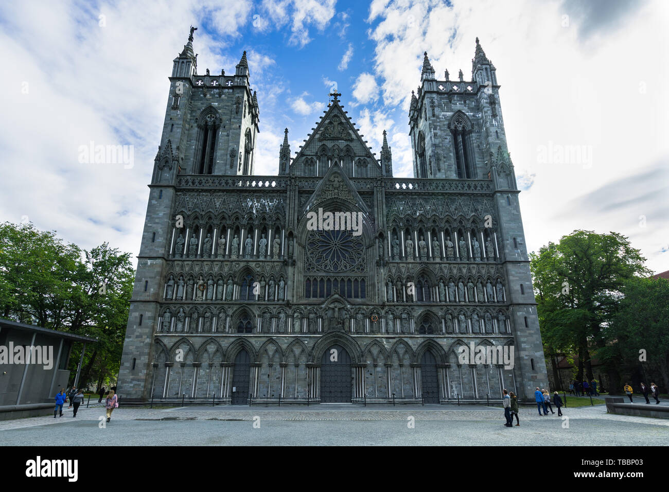 Finely decorated Gothic facade of Nidaros Cathedral (Nidaros Domkirke), the most famous landmark of Trondheim. Trondheim, Norway, August 2018 Stock Photo