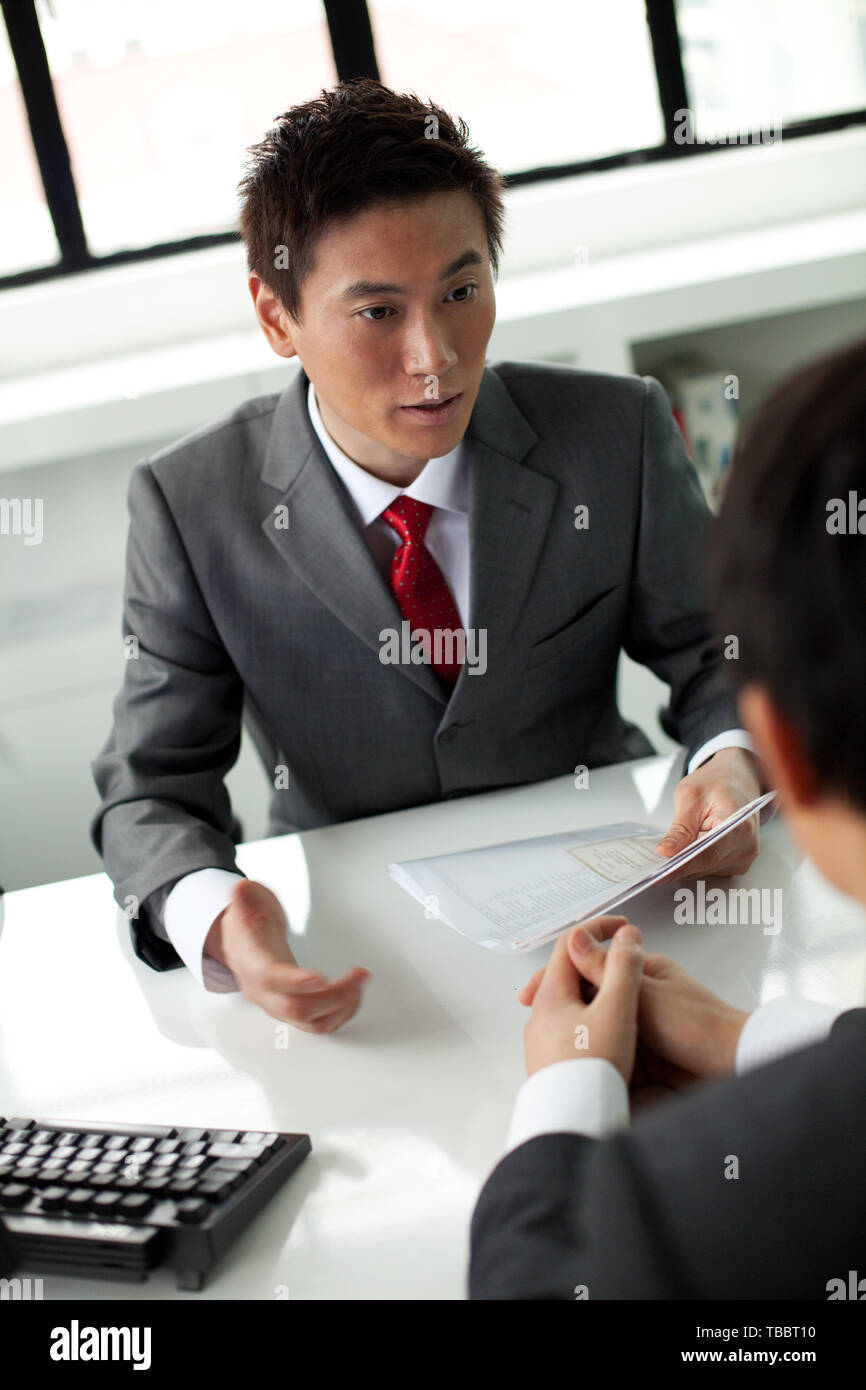 Professional interview scene asian hi-res stock photography and images ...