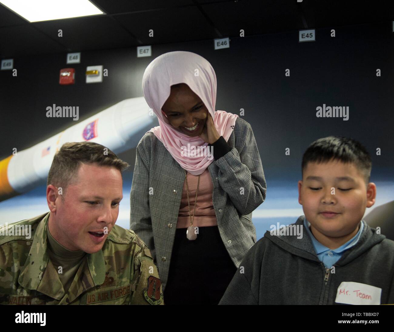 U.S. Rep. Ilhan Omar of Minnesota, center, with children from the Battle Creek Elementary School participating in STARBASE Minnesota during a visit to the the 133rd Airlift Wing May 29, 2019 in St. Paul, Minnesota. STARBASE is an educational program placing students in the community to learn about science and engineering to promote STEM education. Stock Photo