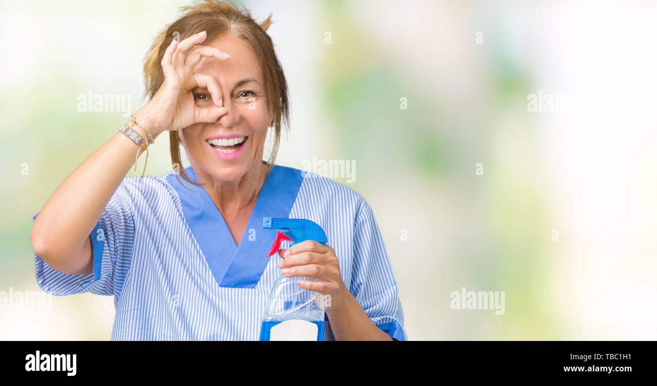 Middle age brunette cleaner woman wearing housework uniform over ...