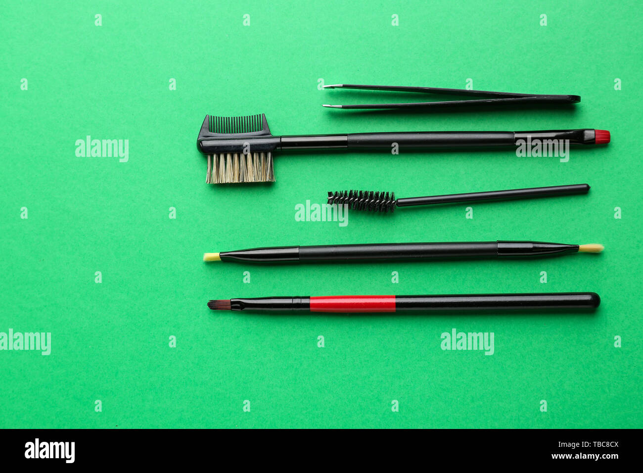 Set of tools for eyebrows correction on color background Stock Photo
