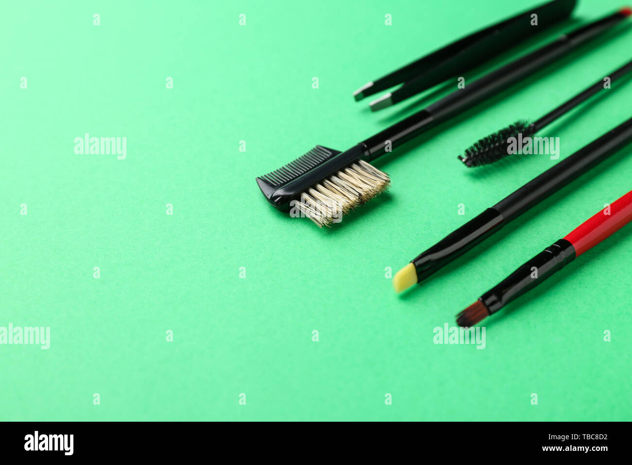 Set of tools for eyebrows correction on color background Stock Photo