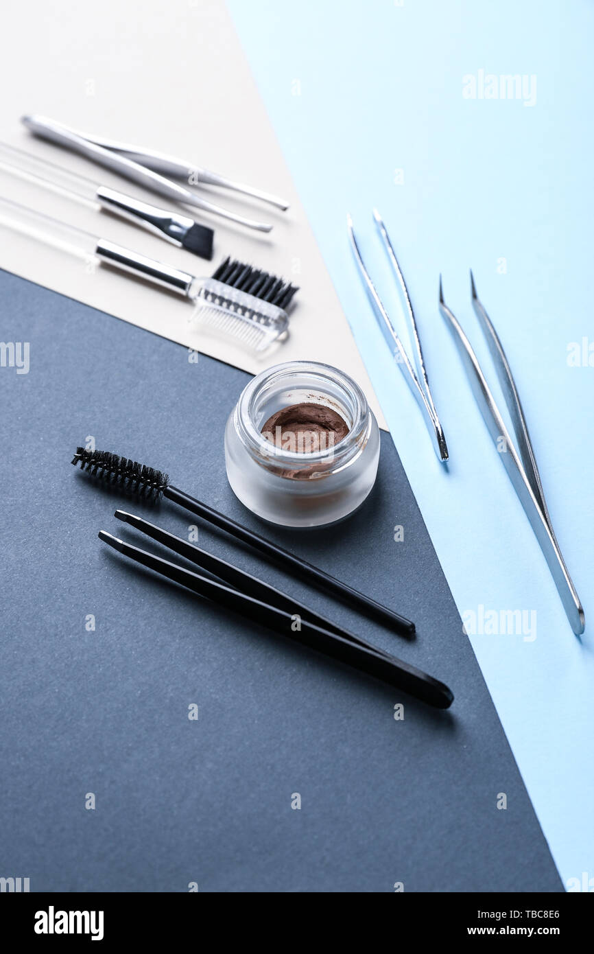 Set of tools for eyebrows correction on color background Stock Photo