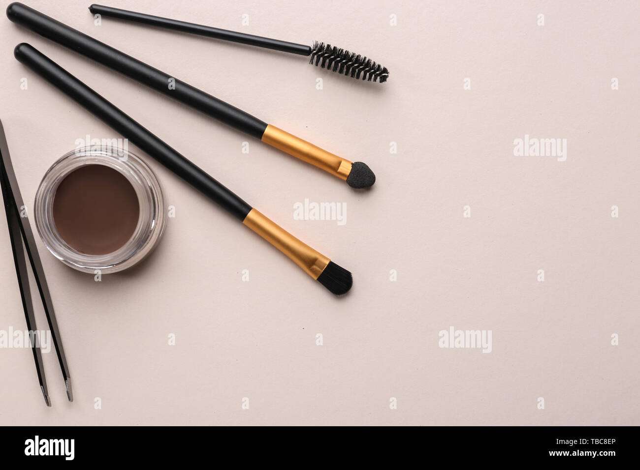 Set of tools for eyebrows correction on color background Stock Photo