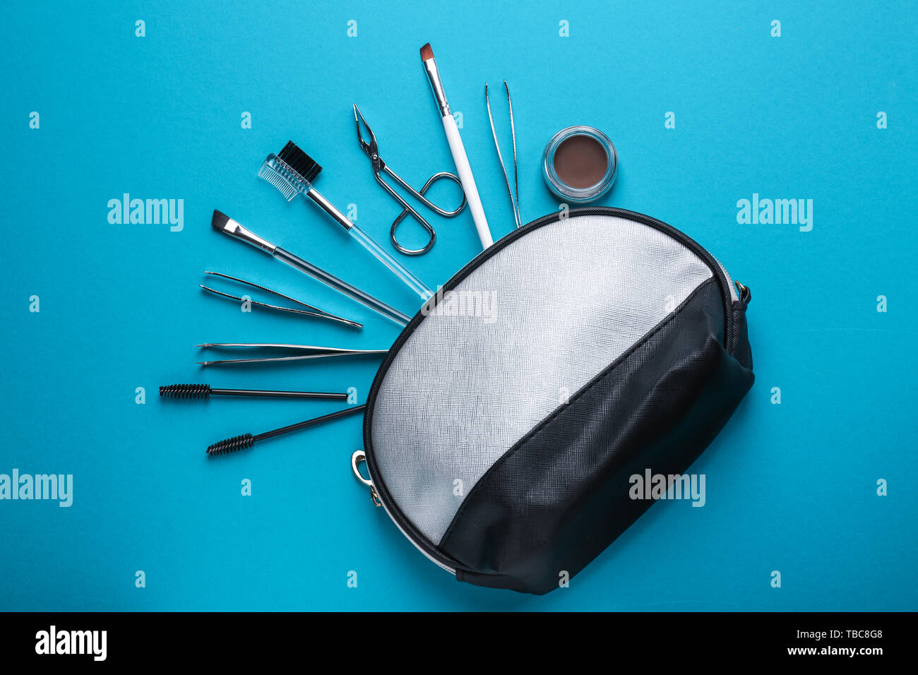 Set of tools for eyebrows correction on color background Stock Photo