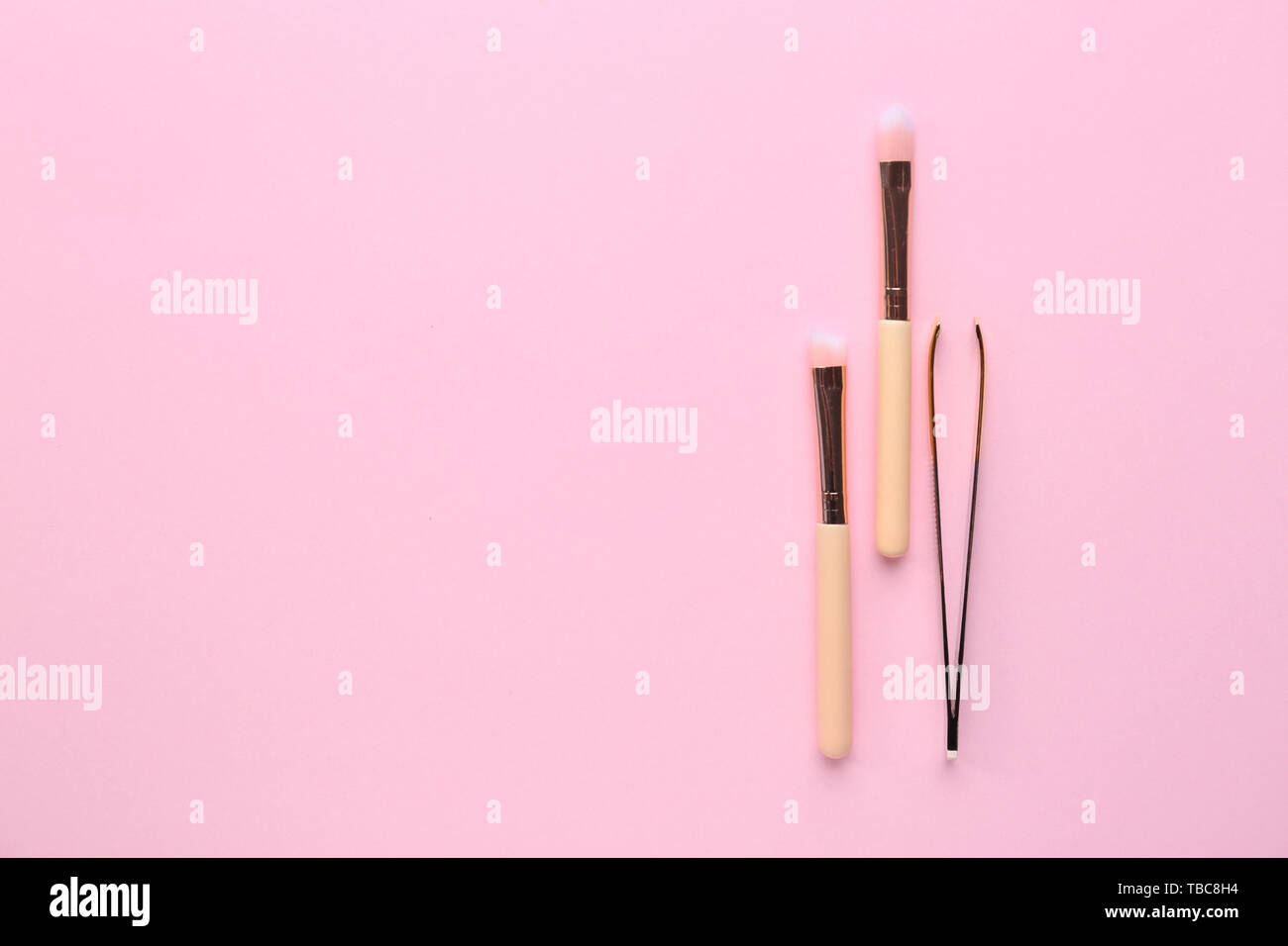 Set of tools for eyebrows correction on color background Stock Photo