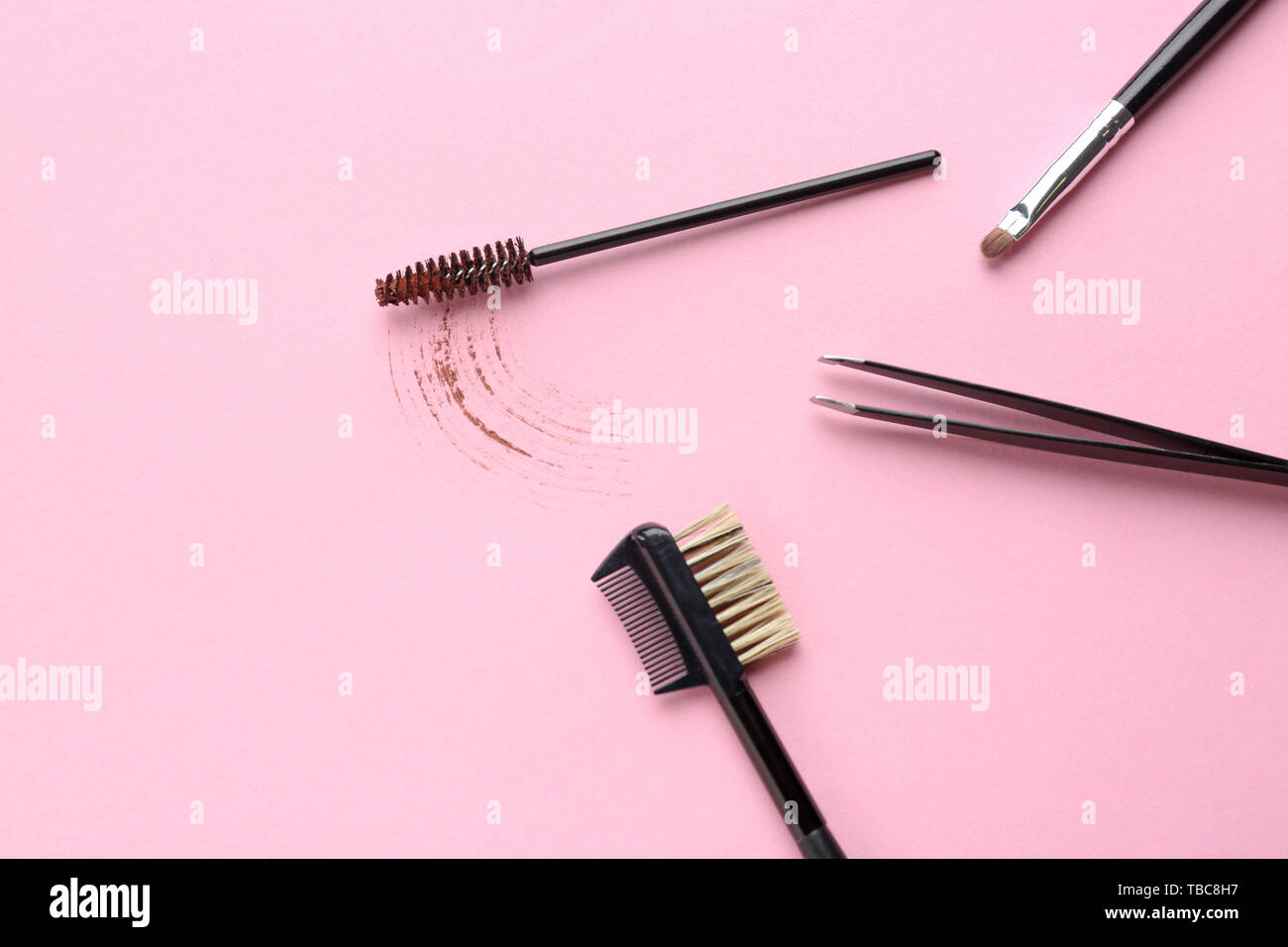 Set of tools for eyebrows correction on color background Stock Photo