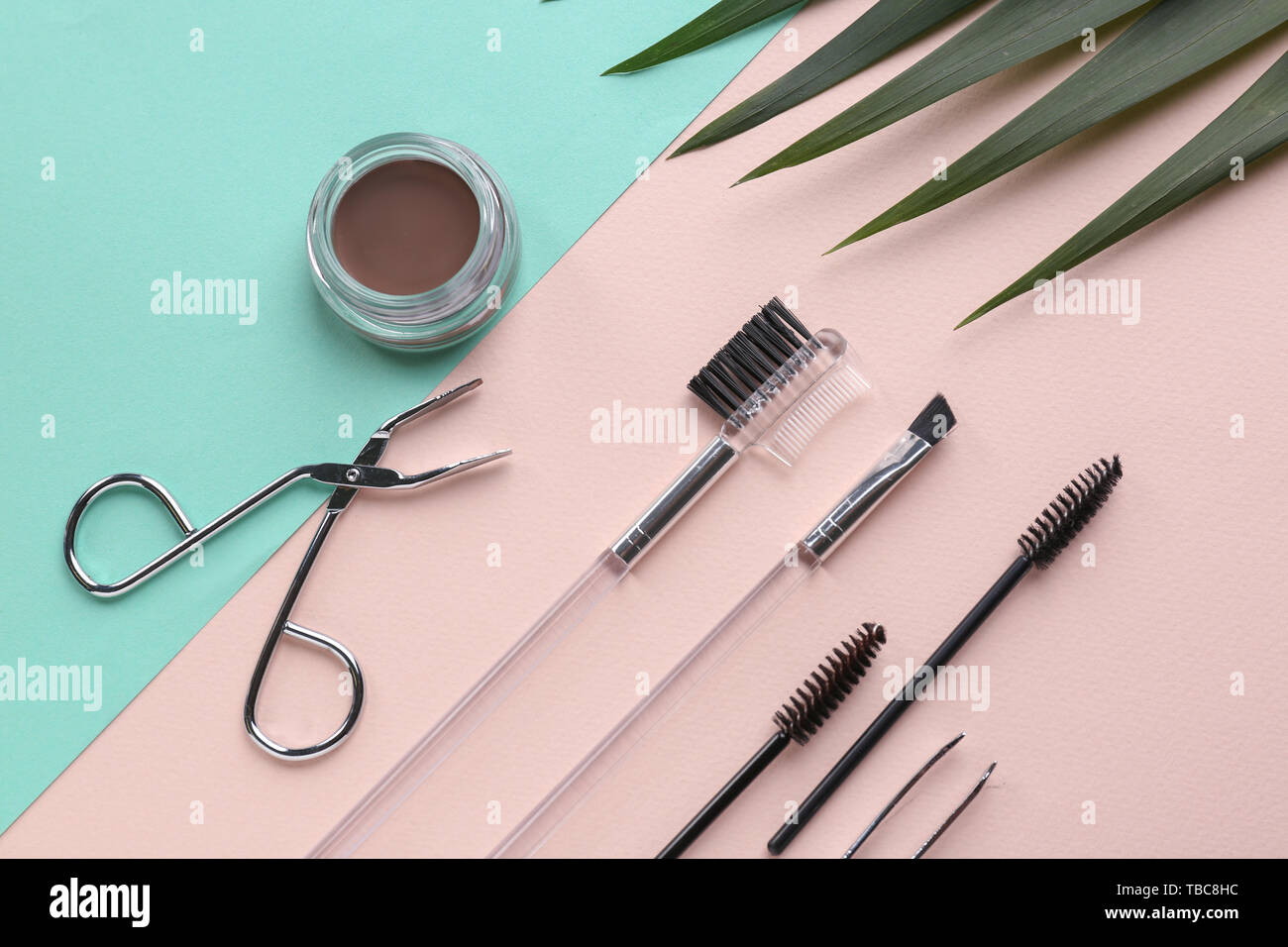 Set of tools for eyebrows correction on color background Stock Photo