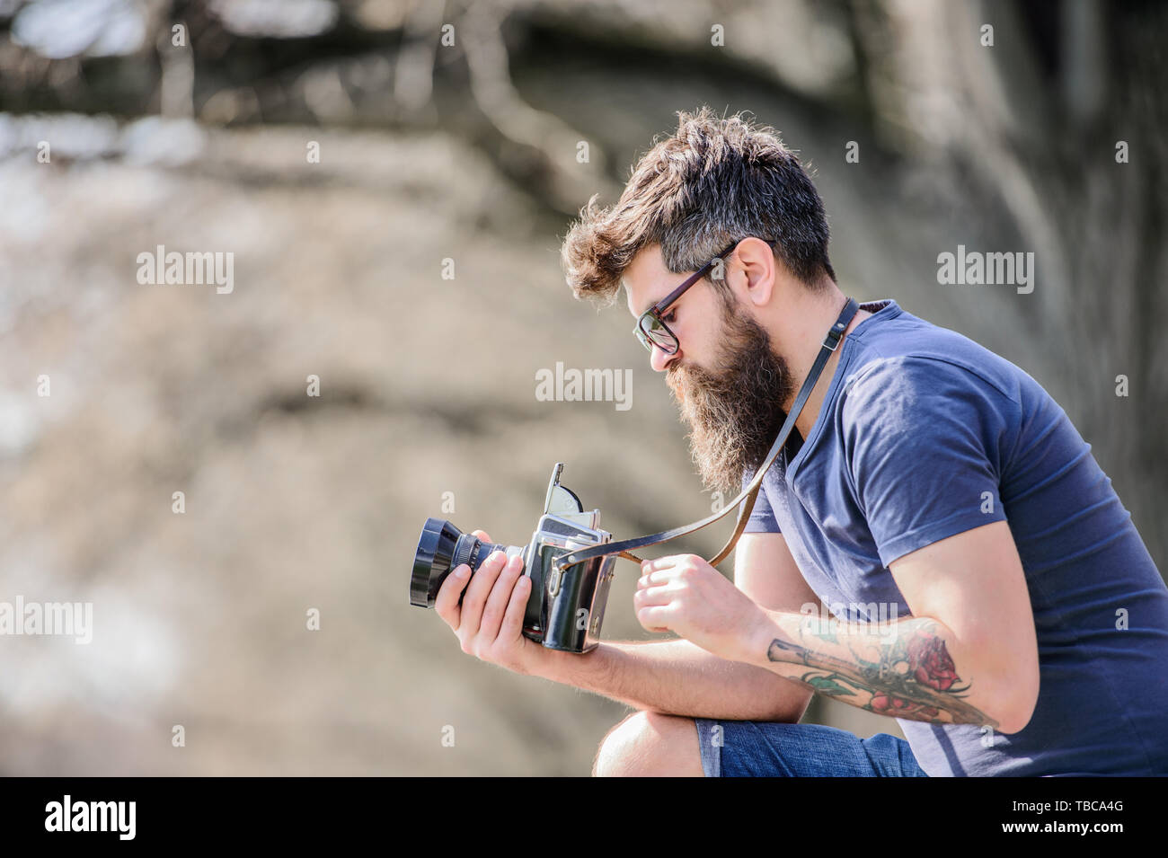 outdoor photographic equipment. hipster man in sunglasses. brutal  photographer with camera. Mature hipster with beard. Bearded man. photo of  nature. reporter or journalist. Enjoying his working day Stock Photo - Alamy