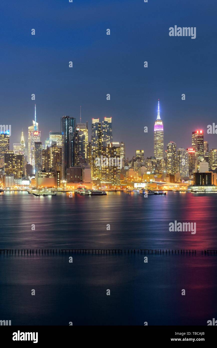 Midtown skyline over Hudson River in New York City with skyscrapers at ...