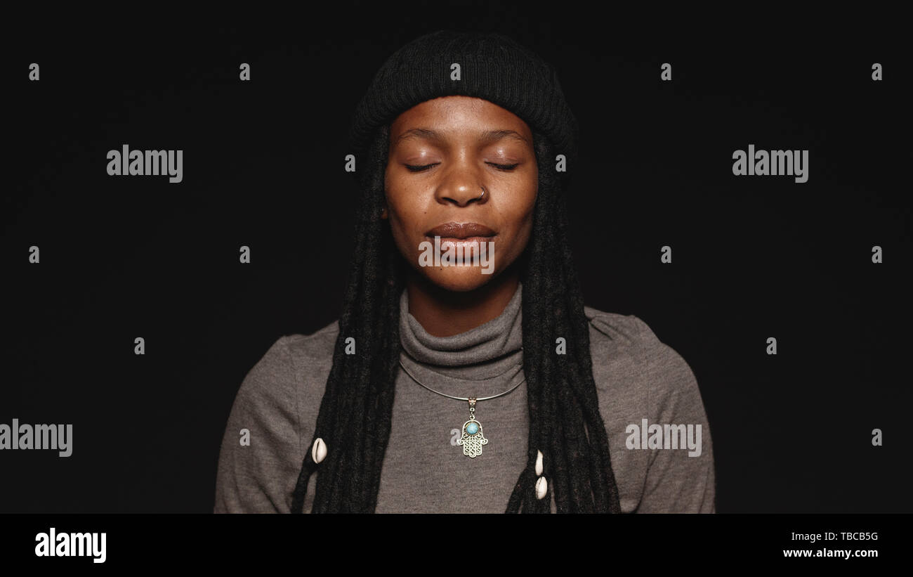 Portrait Of African Female With Closed Eyes Having Long