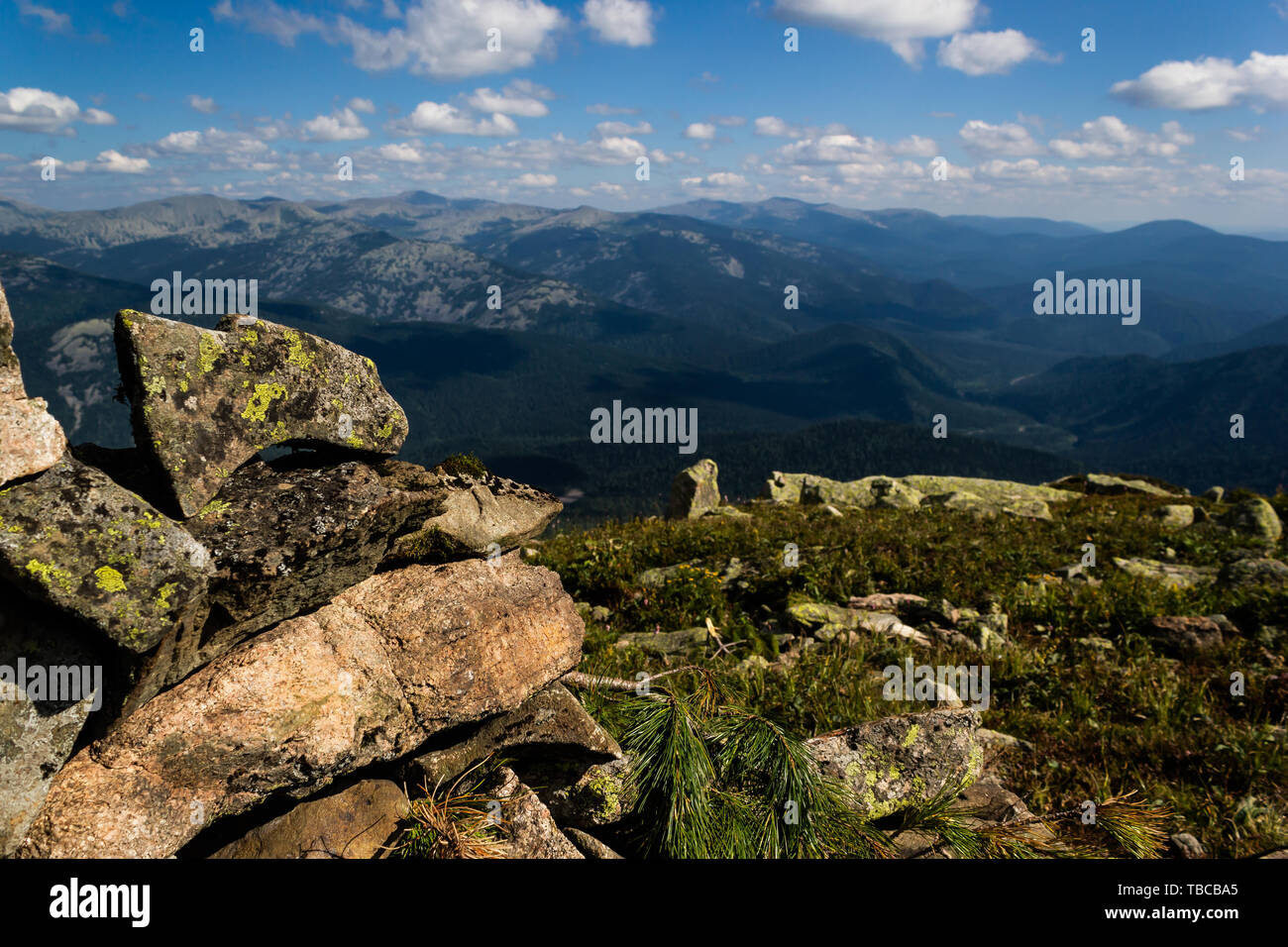 Rocks under blue sky with clouds. View of mountain valley. Tourism ...
