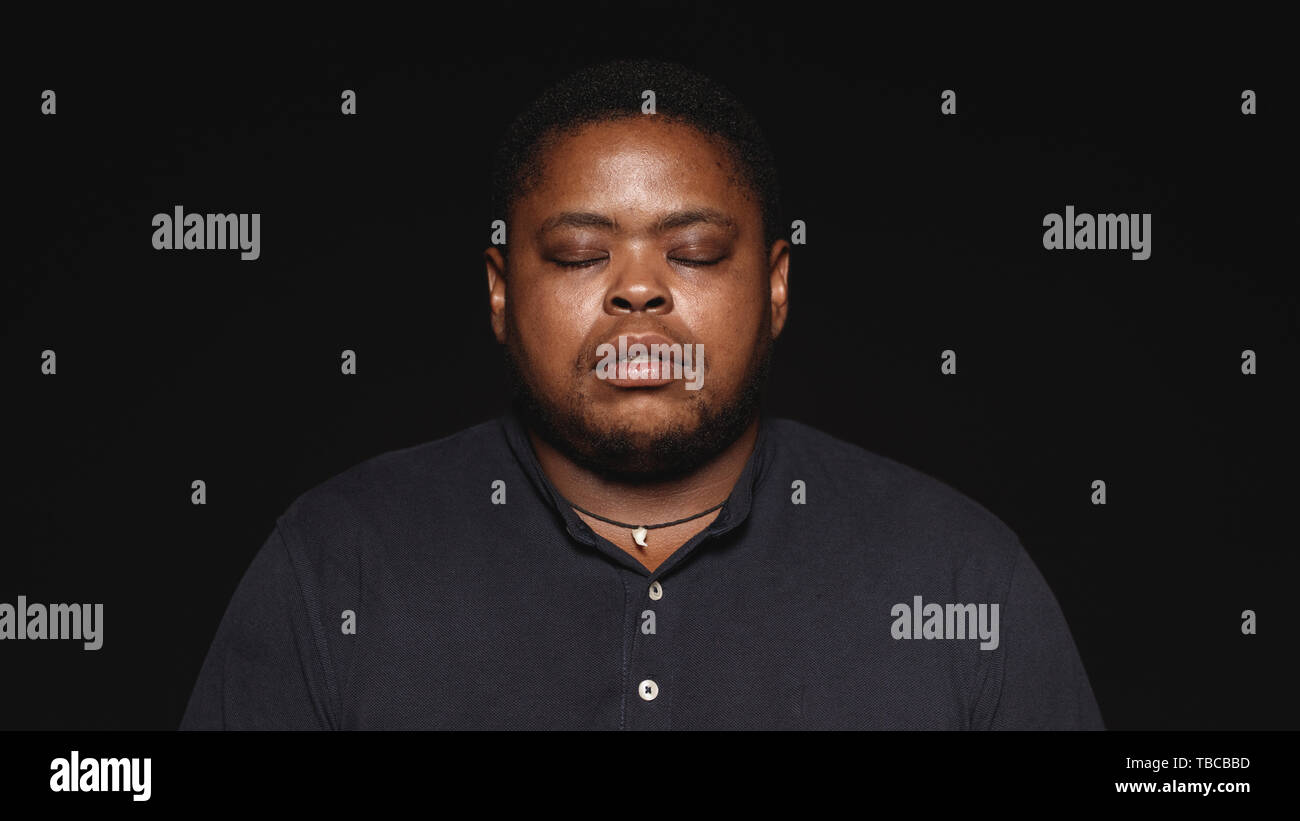 Black man eyes closed portrait hi-res stock photography and images - Alamy