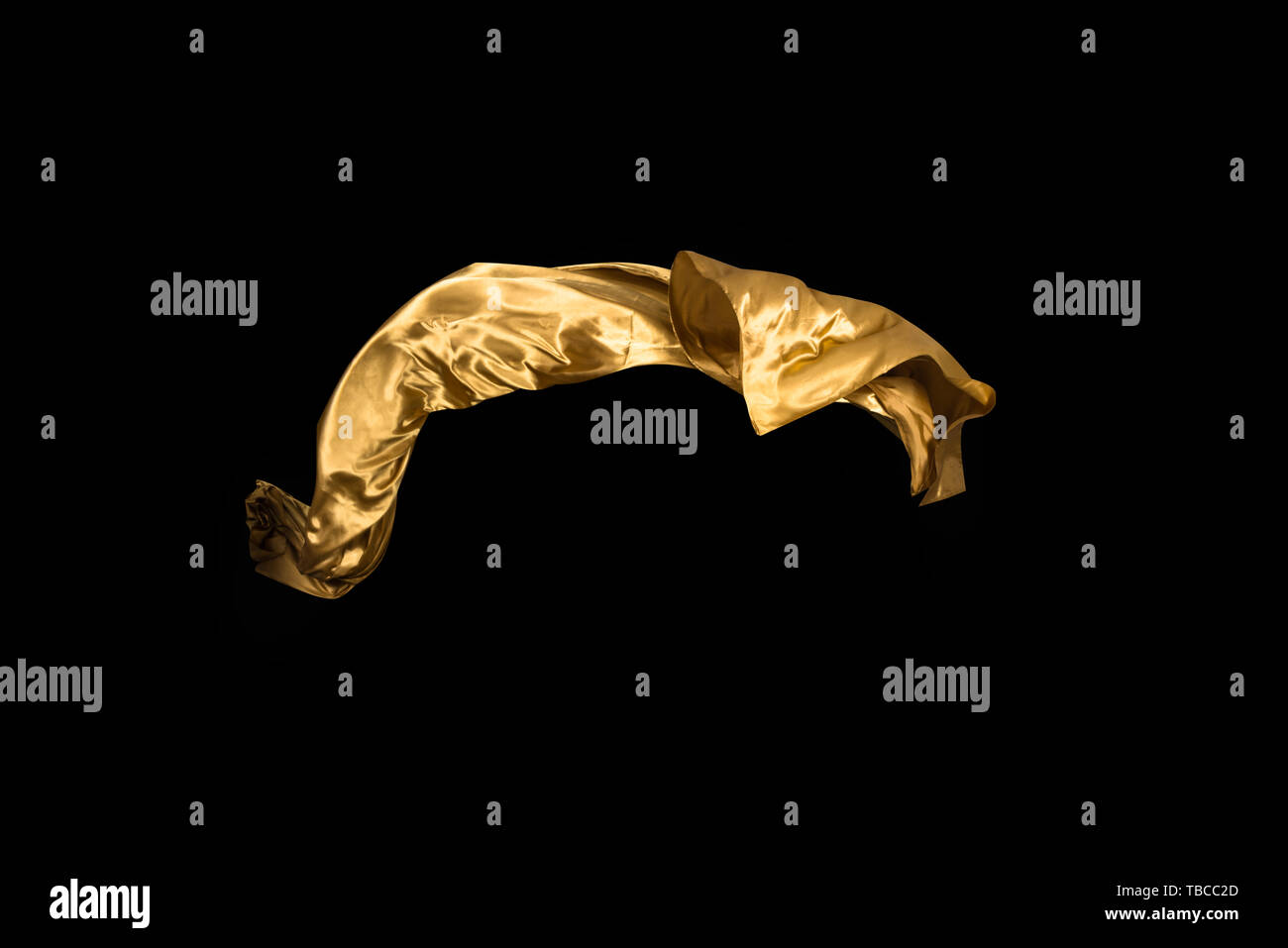 golden soft satin flying in wind on background Stock Photo