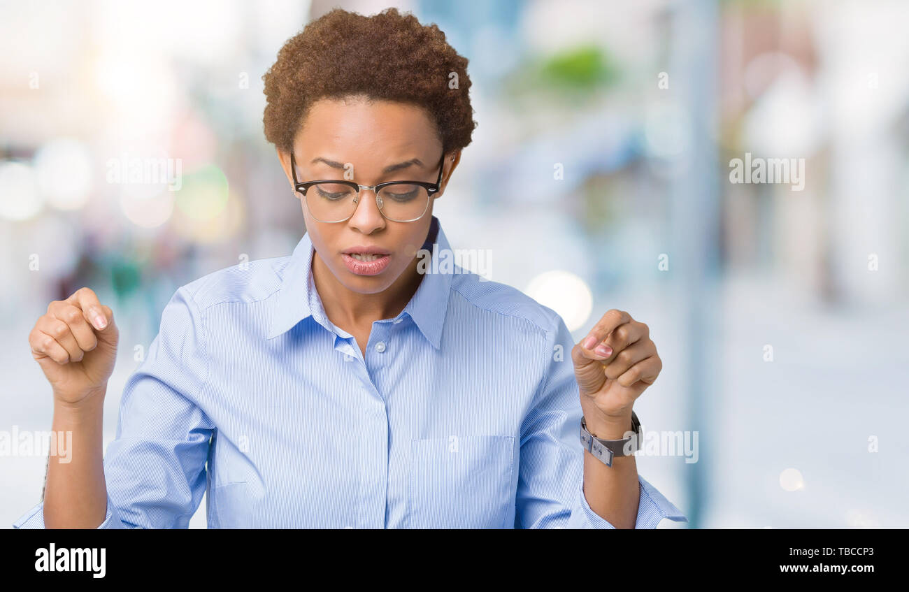 Young beautiful african american business woman over isolated ...