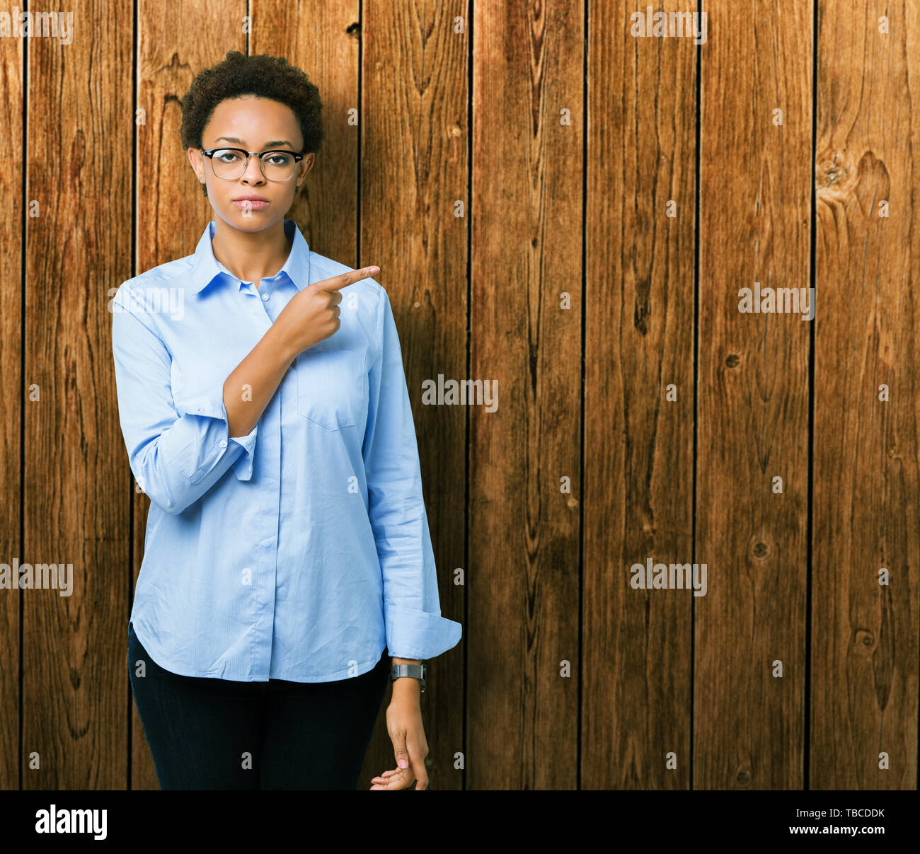 Young beautiful african american business woman over isolated ...