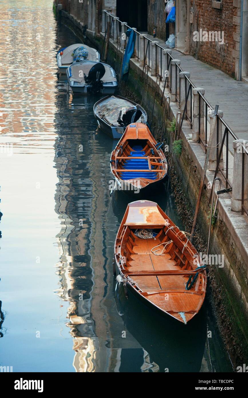 Boat park in Venice alley canal. Italy. Stock Photo