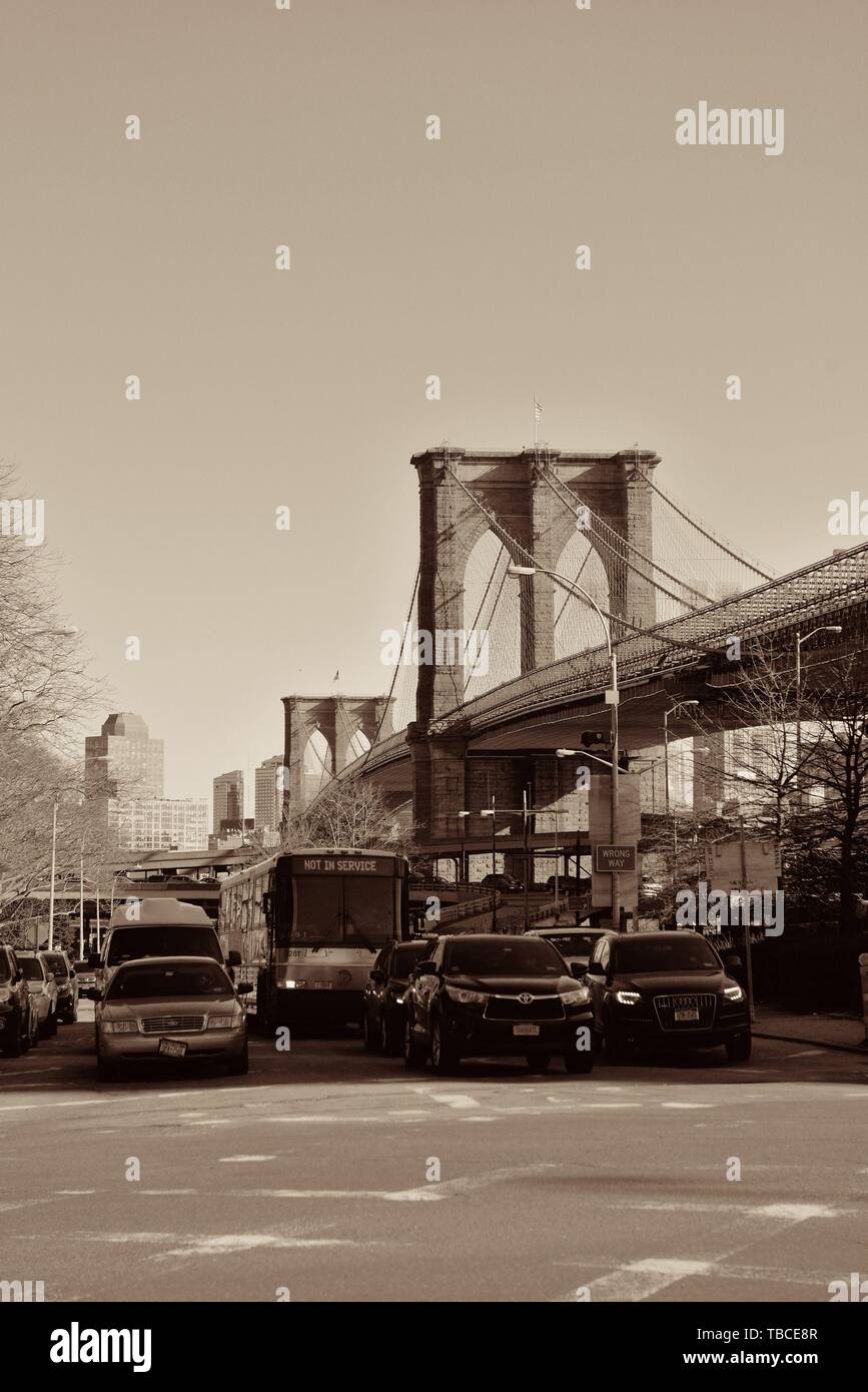 NEW YORK CITY - APR 1: Downtown Manhattan street view with Brooklyn Bridge on April 1, 2015 in Manhattan, New York City. With population of 8.4M, it is the most populous city in the United States. Stock Photo