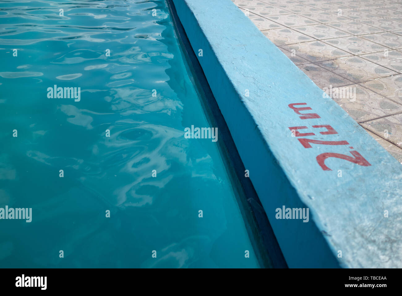 Inviting blue pool with 2.70m depth marking Stock Photo