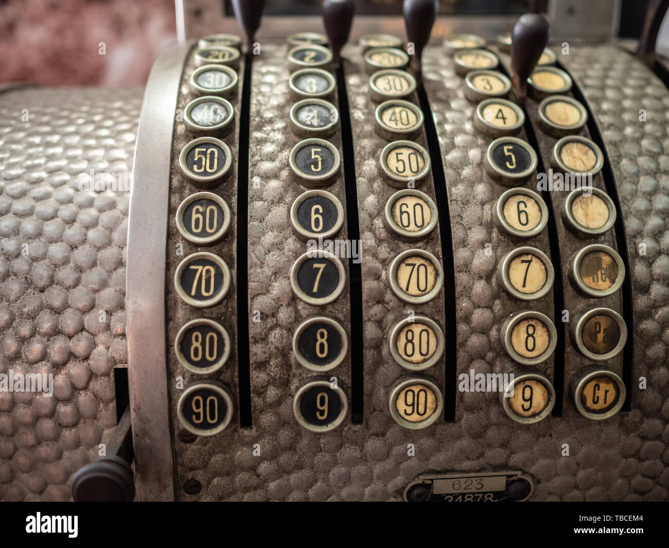 Vintage metal cash register with numbered buttons Stock Photo