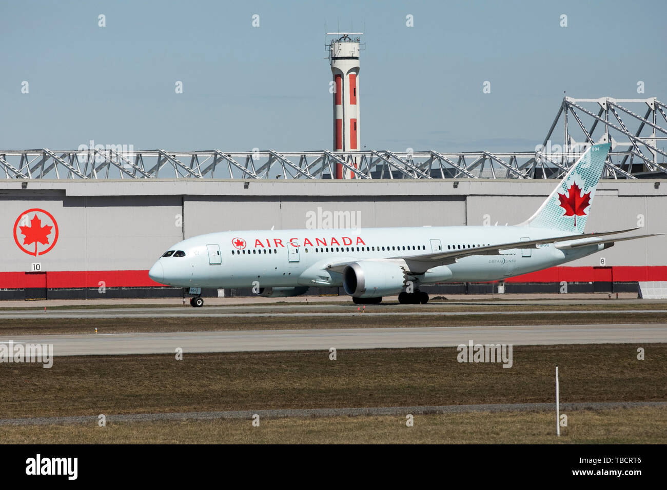 A Air Canada Boeing 787 Dreamliner airplane is seen landing at Montréal-Pierre Elliott Trudeau International Airport in Montreal, Quebec, Canada, on A Stock Photo