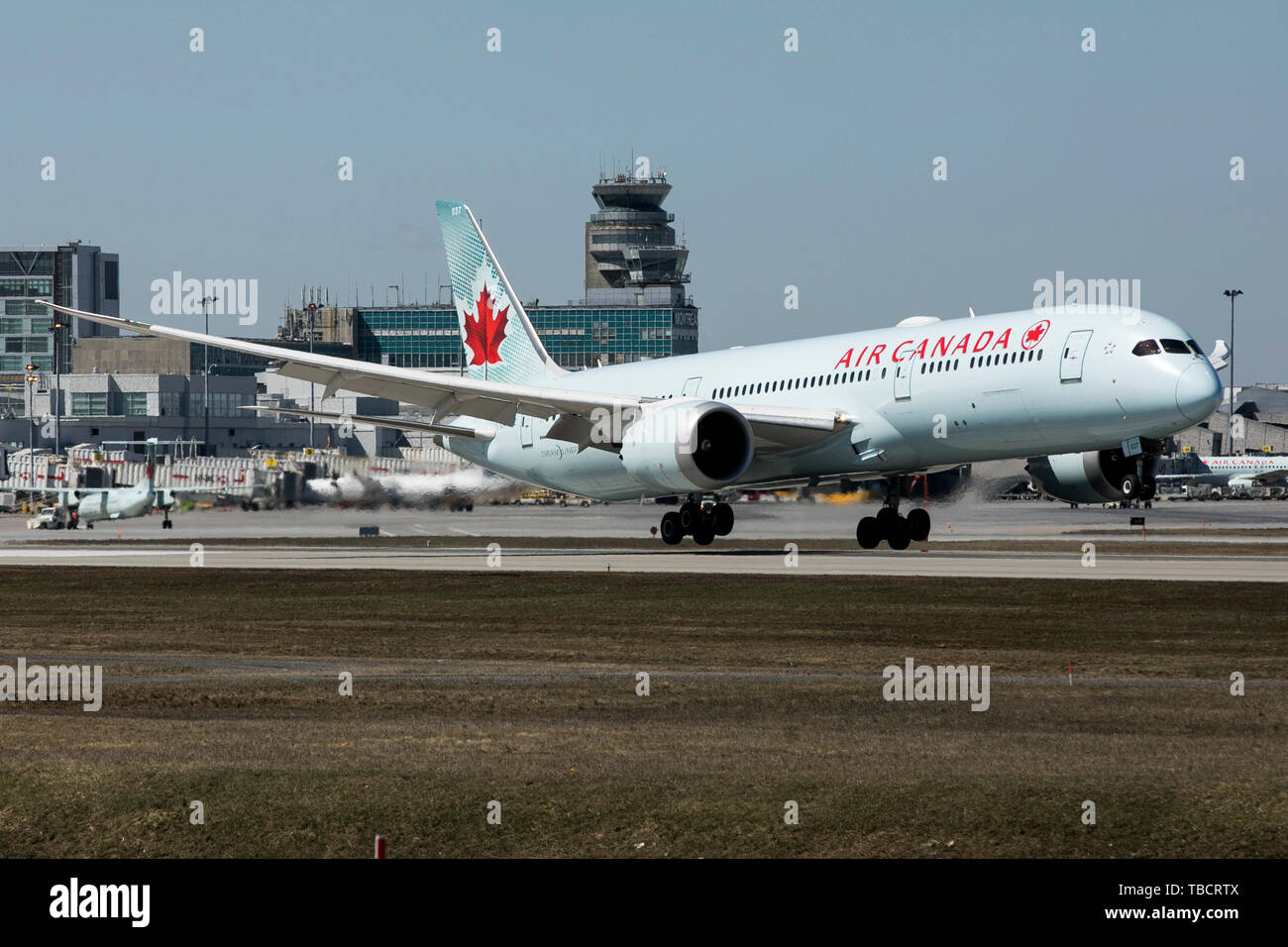 A Air Canada Boeing 787 Dreamliner airplane is seen landing at Montréal-Pierre Elliott Trudeau International Airport in Montreal, Quebec, Canada, on A Stock Photo