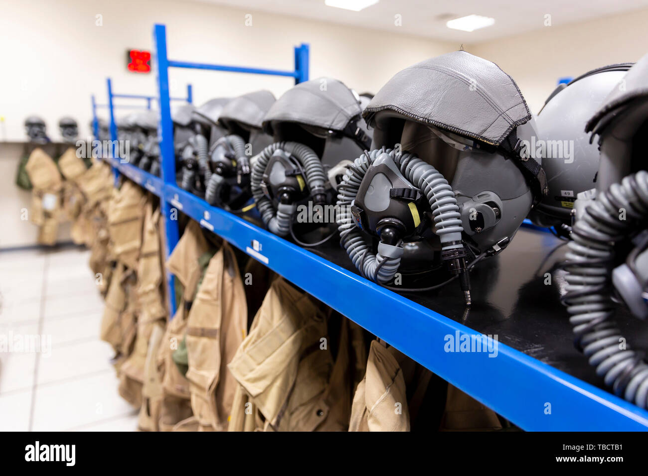 Dressing room of a fighter aircraft (jet fighter) pilot with uniforms