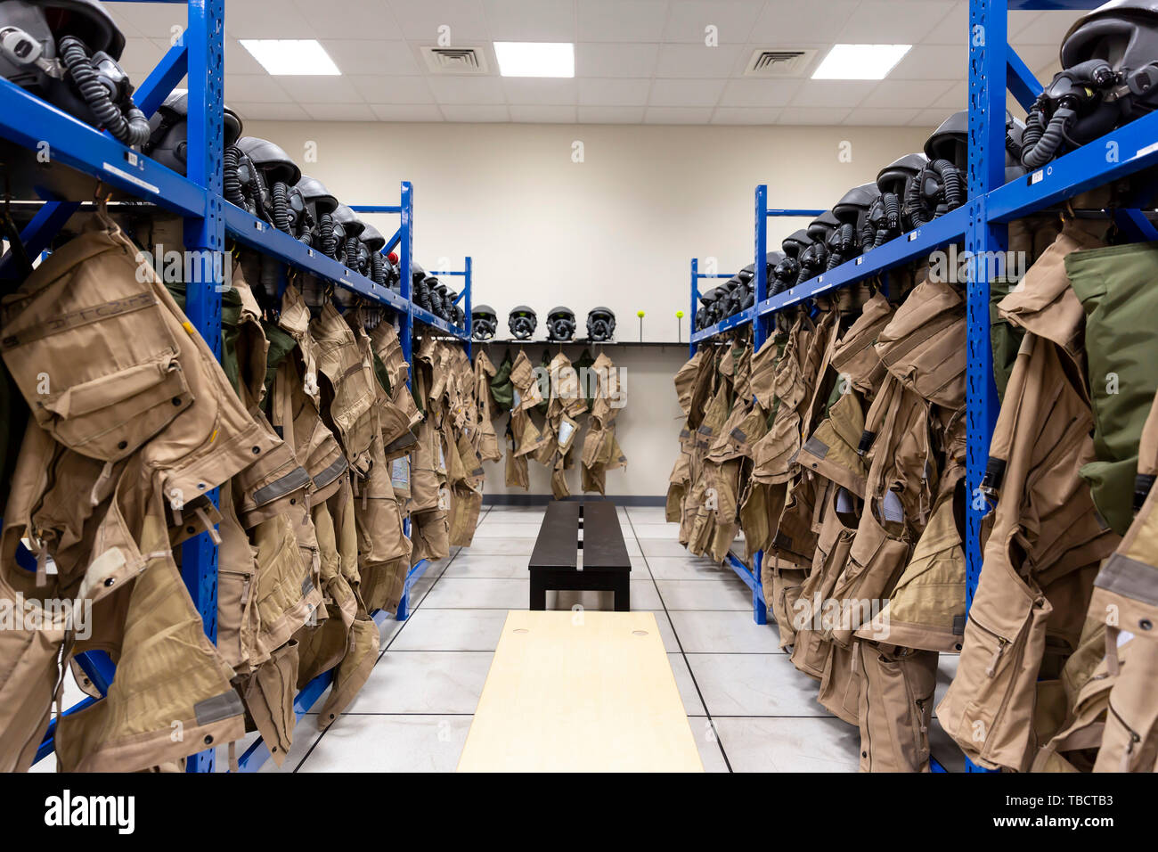 Dressing room of a fighter aircraft (jet fighter) pilot with uniforms