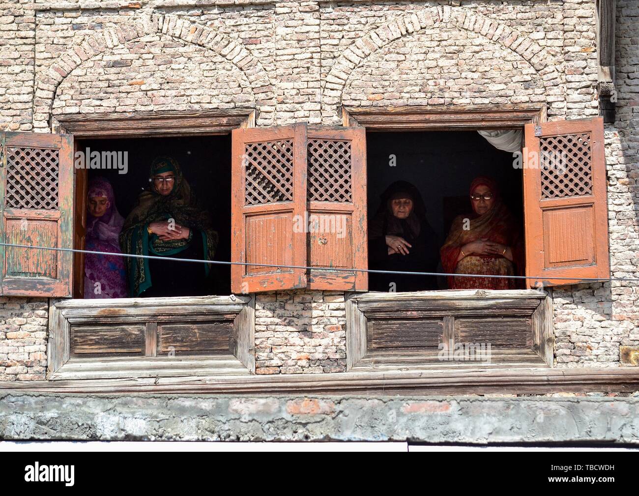 Kashmiri Muslims offer prayers inside a residential house during the last Friday of the holy fasting month of Ramadan in Srinagar. Muslims throughout the world are marking the month of Ramadan, the holiest month in the Islamic calendar in which devotees fast from dawn till dusk. Stock Photo