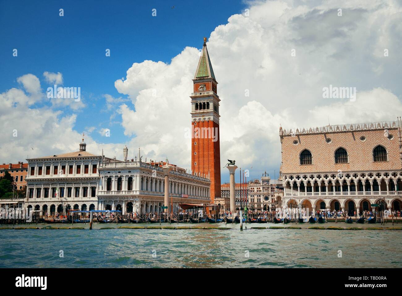 Waterfront view of Bell Tower and historical buildings at Piazza San Marco in Venice, Italy. Stock Photo