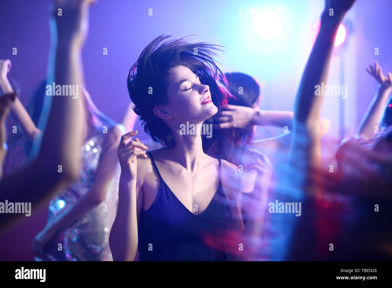 Beautiful young women dancing in night club Stock Photo Alamy