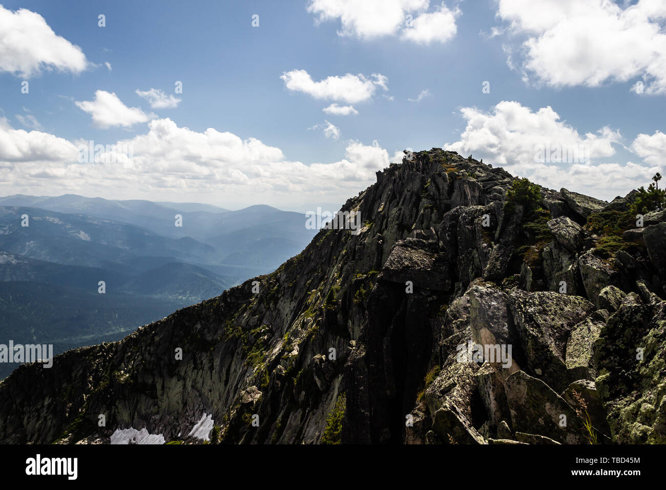Rocks under blue sky with clouds. View of mountain valley. Tourism ...