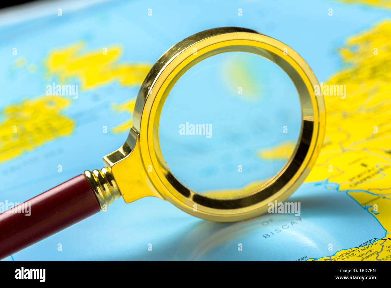 Magnifying glass and map Stock Photo - Alamy