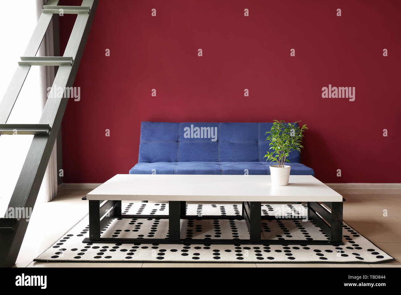 Interior of modern room with comfortable sofa and table Stock Photo - Alamy
