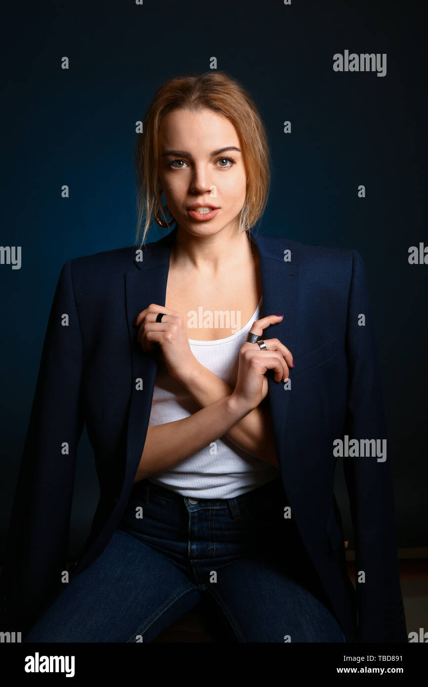 Portrait of beautiful young woman on dark background Stock Photo - Alamy