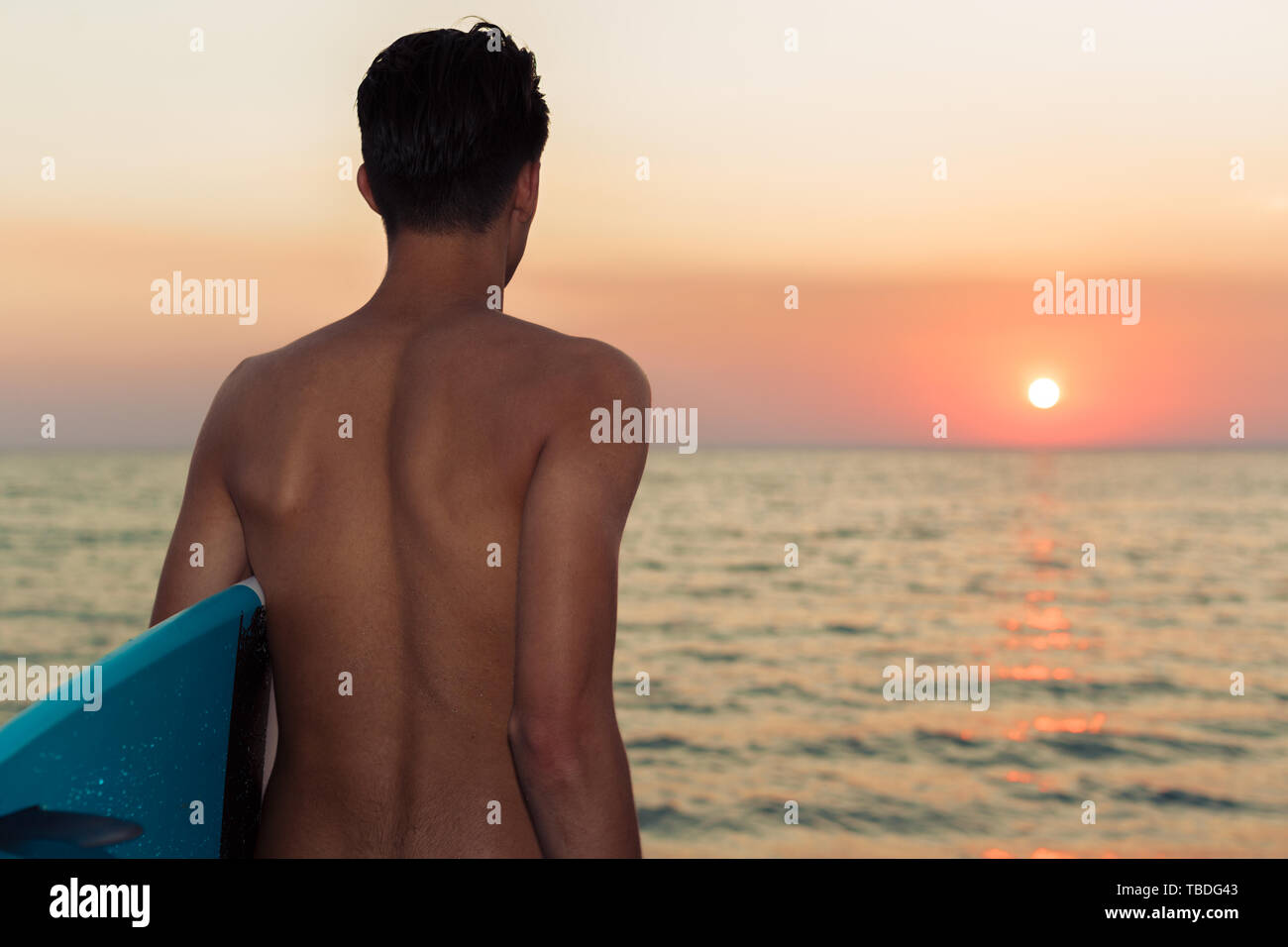 Silhouette surfer holding surfboard on hi-res stock photography and ...