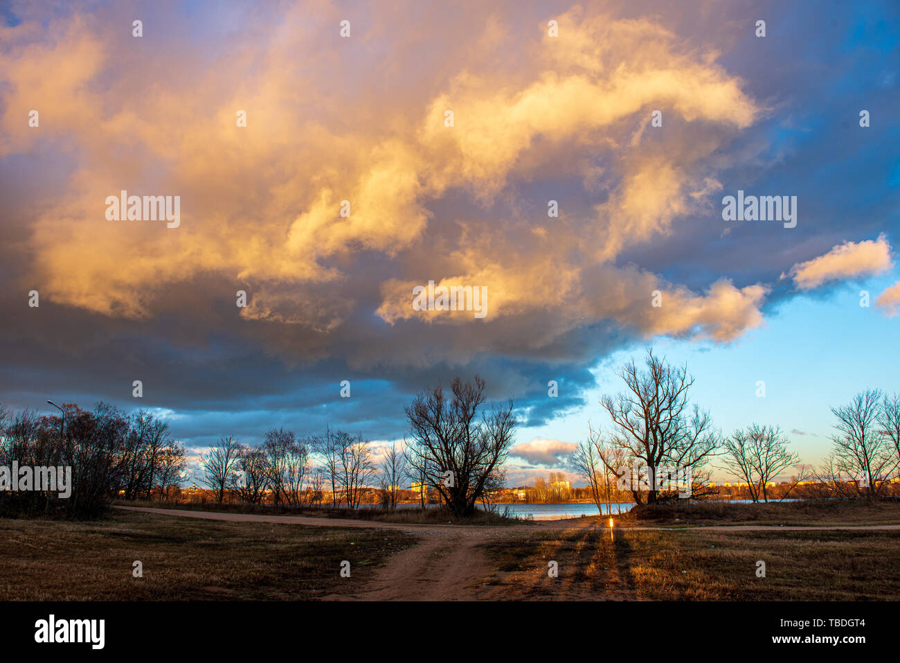 clear sky with dramatic clouds over the lake in sunset. countryside ...