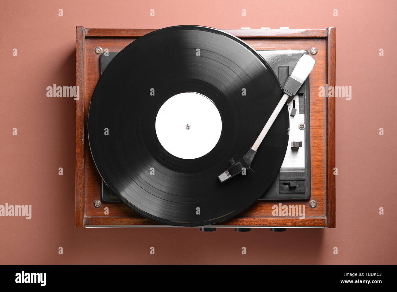 Record player with vinyl disc on color background Stock Photo - Alamy