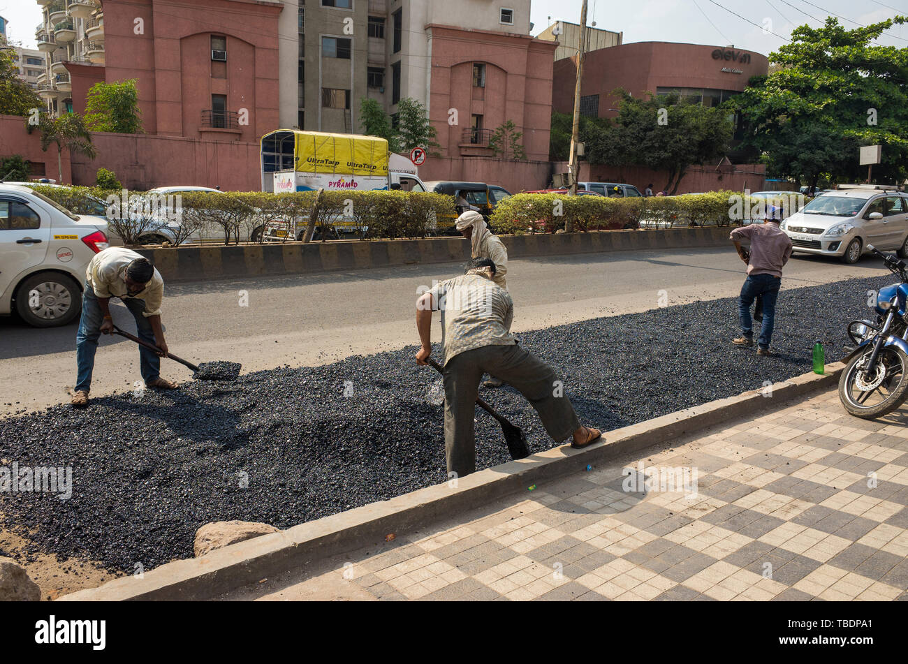 Pune,  Maharashtra / India - 03 30 2019. Workers on street Stock Photo