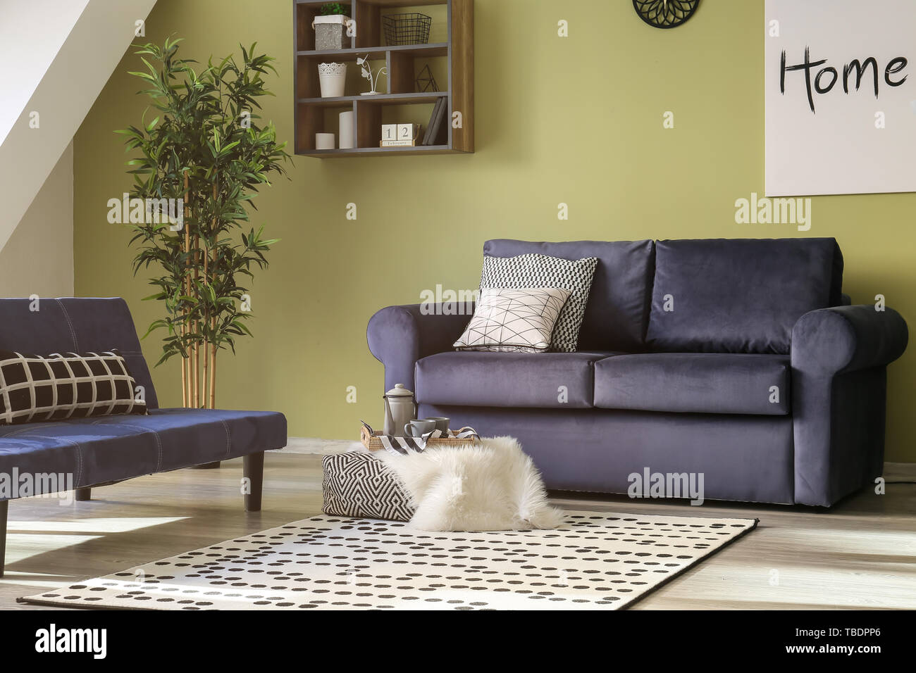 Interior of beautiful modern room with comfortable sofa Stock Photo - Alamy