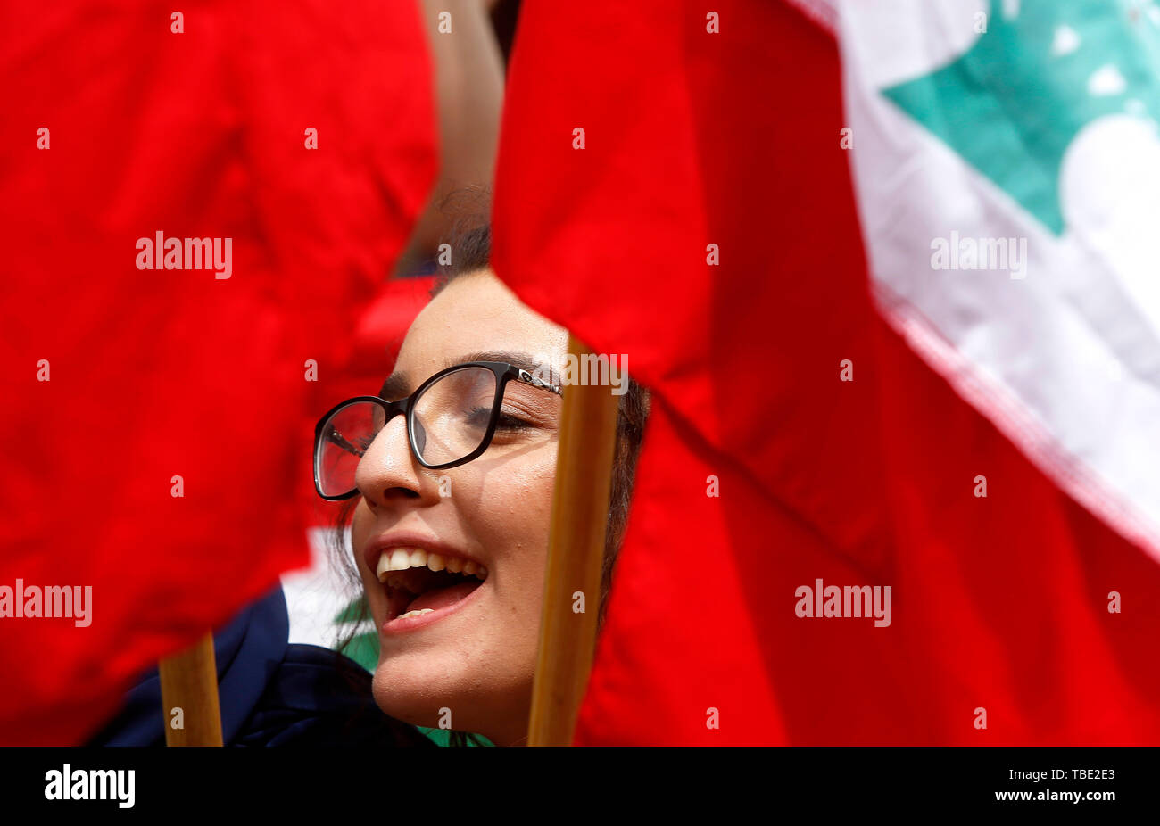 Beijing, China. 24th May, 2019. A woman attends a protest in the downtown of Beirut, Lebanon, May 24, 2019, refusing to reduce the budget of the university within the policy of the government's drafted austerity budget. Credit: Bilal Jawich/Xinhua/Alamy Live News Stock Photo